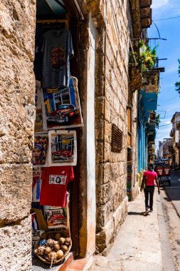 Experience the essence of Cuba in Havanas streets filled with iconic architecture vintage cars and a lively spirit clipart