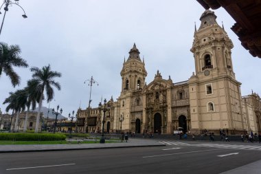 Capture the magnificent facade of Lima Cathedral highlighting its colonial architecture and cultural significance as a historic and religious landmark in the heart of Peru clipart