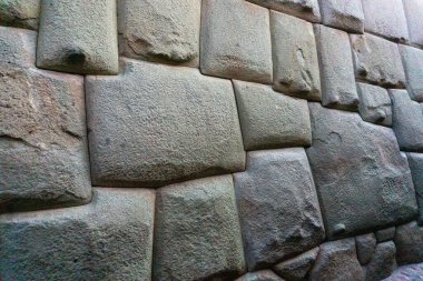 closeup view of the famous Twelve Angled Stone in Cusco Peru showcasing its intricate and precise Inca craftsmanship clipart