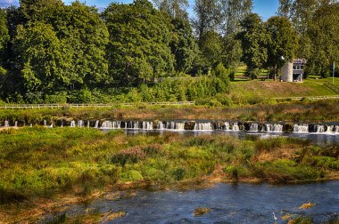 Kuldiga. Ventas-Rumba waterfall.The widest waterfall in Europe (249 m), of natural nature, a number of legends and historical events are associated with the waterfall.