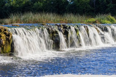 Kuldiga. Ventas-Rumba waterfall.The widest waterfall in Europe (249 m), of natural nature, a number of legends and historical events are associated with the waterfall.