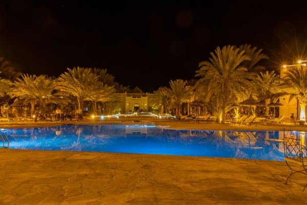 Kasbah-Hotel Chergui. Pool and garden of a maroccan kasbah hotel at night, Maroc, Africa.