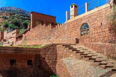 Morocco Atlas Mountains - Kasbah built in adobe overlooking a fertile valley between Marrakesh and Ourika clipart