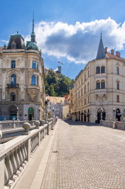 Main street of the city center, Stritarjeva ulica with Ljubljana castle, Ljubljanski grad, Ljubljana, Slovenia clipart