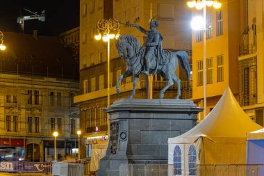 Zagreb, Croatia - APRIL 11, 2024: Equestrian Statue of Ban Josip Jelacic and Iconic Yellow Buildings of Old Town Zagreb clipart