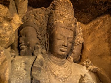 Trimurti Sadashiva sculpture in the cave on Elephanta Island. Mumbai - Maharashtra, India.