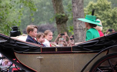 London UK - 17 June 2023: Queen Camilla, Kate Princess of Wales, Prince George, Prince Louis princess Charlotte Trooping the colour Royal Family carriage on Mall Buckingham Palace  clipart