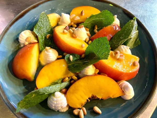 peaches and whipped ricotta cheese, mint and pine nuts modern twist on peaches and cream