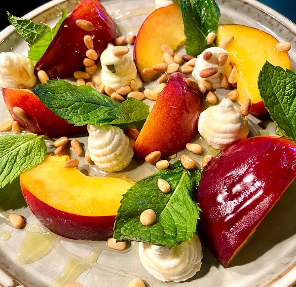 peaches and whipped ricotta cheese, mint and pine nuts modern twist on peaches and cream