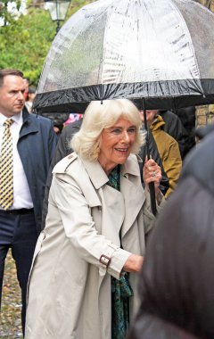 Rye, East Sussex, UK- 16.05.2024: Queen Consort Camilla visits Rye Church and Lamb house to celebrate Literature history meets crowds in the rain  clipart