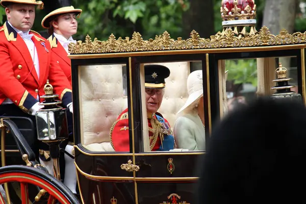 Stock image  London. June 15th 2024 - King Charles iii, Queen Camilla, in a carriage during the Trooping the Colour celebrations parade