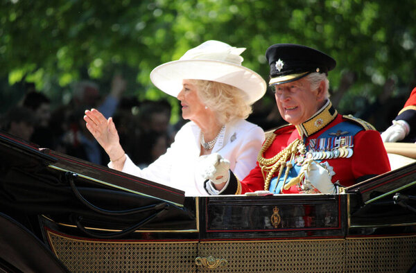 London, UK - 14.06.2025 King Charles and Queen Camilla in  carriage at Trooping the Colour 2025 waving to crowds King Charles iii in uniform - video footage