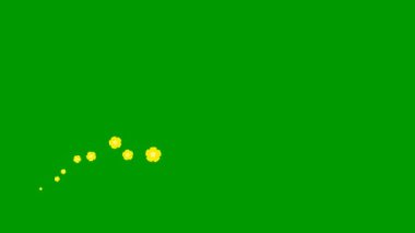 Animated yellow beautiful flowers fly from left to right. Looped video. Concept of spring. A wave of flying flowers on green background.