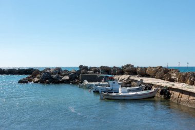 September 13th 2022 - Mathraki, Greece - Picturesque gulf with a small dock in Mathraki island, Greece