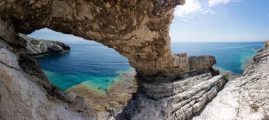 Amazing rocky formations and gorgeous sea waters of the south coastline in Othonoi island, Greece clipart