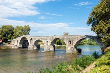 The famous stone bridge over the river Arachthos, in Arta, Greece clipart