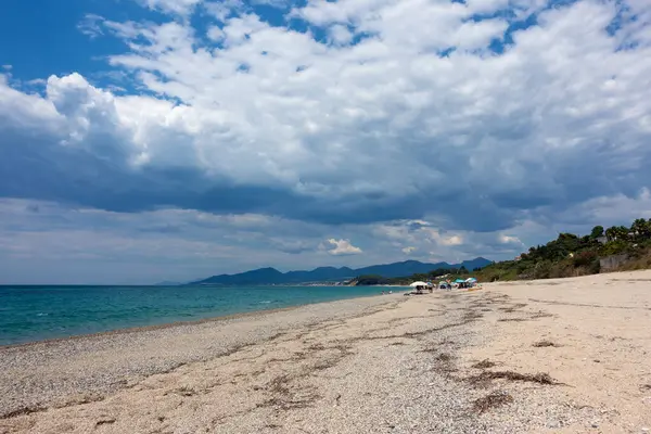 stock image August 12th 2023 - Preveza, Greece - Amazing Monolithi beach in Preveza, Greece, with people enjoying the sea