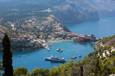 View down to the beautiful bay of Assos village, Kefalonia island, Greece, from the surrounding hills clipart