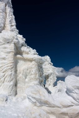 The chapel of Saints Peter and Paul on top of Kaimaktsalan mountain, covered with ice and snow, where a great battle took place in WWI between Serbian and Bulgarian troops clipart