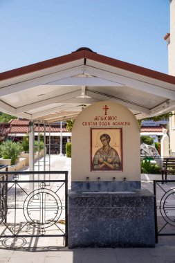 June 27th 2024 - Prokopi, Greece - Plaza in Prokopi village, North Evia, Greece, a popular religious destination  clipart