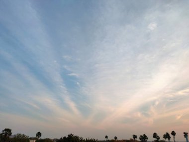 Clouds formation like rays and blue sky landscape