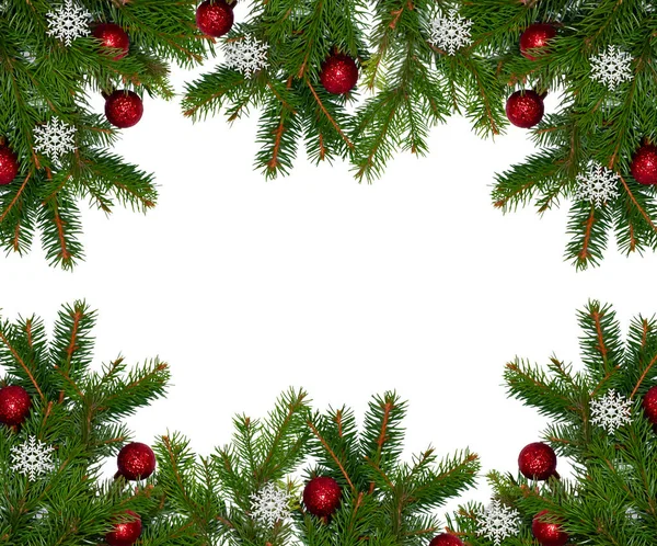 Christmas branch of a natural tree with red balls on a white background close-up. Isolate.