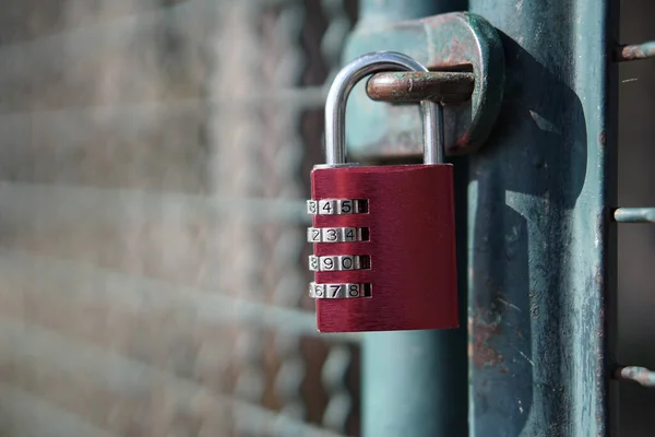 Red lock on the lattice door