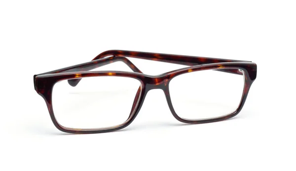 Horn-rimmed glasses on white background