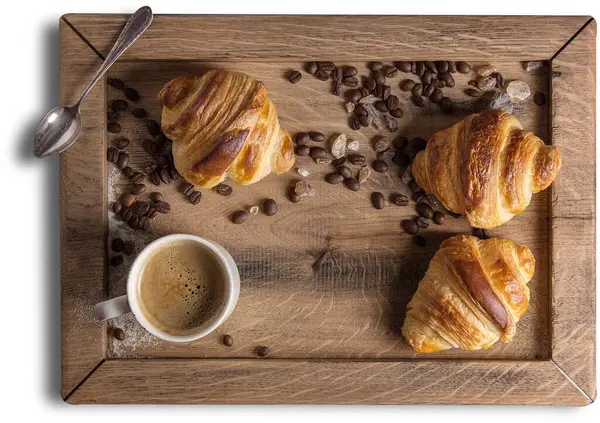 Croissant is a buttery pastry named for its historical crescent shape.