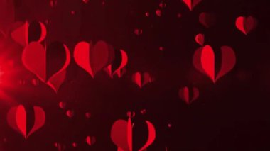 Kırmızı kalpler, karanlık arka planda parlak bir etki yaratarak şenlikli ve romantik bir atmosfer yaratıyor. Kutlamalar ve Sevgililer Günü için ideal..