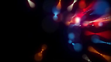 Karanlık bir arkaplan karşısında renkli Bokeh ışıklarının büyüleyici bir görüntüsü soyut ve canlı bir sahne yaratıyor. Festival ve kutlama temaları için ideal.