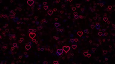 Siyah bir arka planda, bulanık efektli, kusursuz pembe ve mavi kalpler..