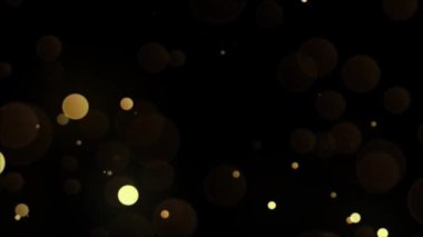 Siyah arkaplandaki soyut altın bokeh.