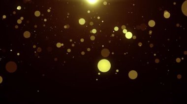 Siyah arkaplanda altın bokeh ışıkları olan soyut arkaplan.