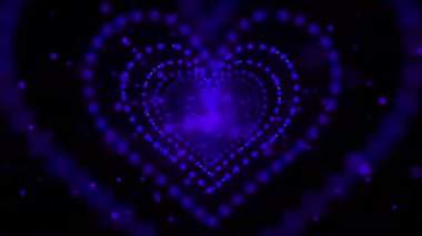 Siyah arkaplanda parlayan parçacıklardan oluşan soyut yeşil kalp şekli.