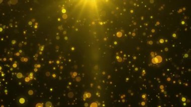 Parlayan ışıkları ve bir ışık demeti olan soyut altın renkli arkaplan.