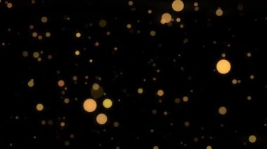 Siyah zemin üzerinde parıldayan altın halkalar olan soyut bir arkaplan.