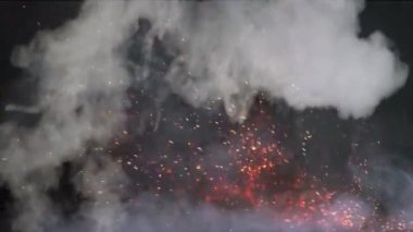 Aşağıda dağınık kıvılcımlar olan yoğun beyaz duman, koyu bir arka plana doğru yükseliyor..