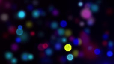 Siyah arkaplanda renkli bokeh ışıkları olan soyut arkaplan.