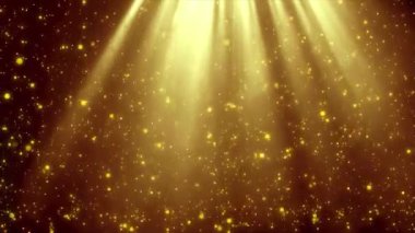 Parlak ışıkları ve ışıldayan ışınları olan soyut altın arkaplan.