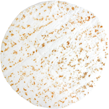 Yuvarlak, desenli, açık ve koyu benekli pirinç kekine benzeyen bir yüzey..