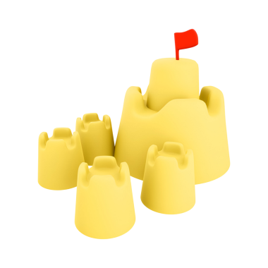 Küçük bir bayrağı olan renkli bir kumdan kale sahilde eğlence ve yaratıcılığı temsil ediyor..