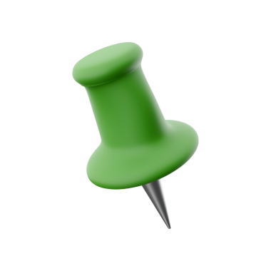 Yeşil bir raptiye, genellikle notları veya kağıtları tahtaya iğnelemek için kullanılır.