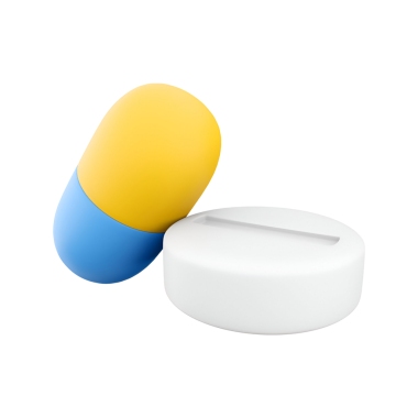 Renkli bir kapsül ve beyaz bir tablet, ilaç ve sağlığı temsil ediyor..