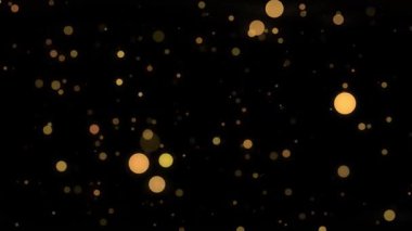 Arkaplanda altın renkli ışıklar serpiştirilmiş soyut bir arkaplan.