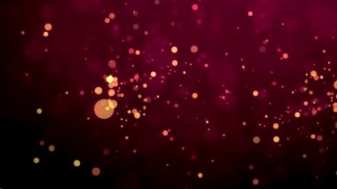 Renkli Bokeh ışıklarının turuncu ve altın tonlarında koyu bir arkaplanda yer aldığı canlı ve soyut bir arkaplan..