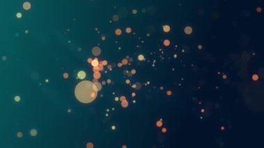 Yumuşak, parlak bokeh ışıklarının koyu bir arka plana karşı sıcak tonda olduğu soyut bir arkaplan.