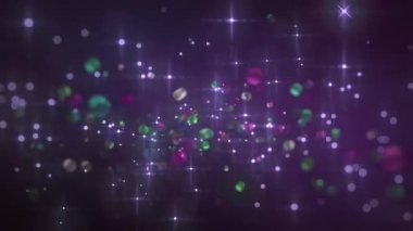 Renkli parçacıkların ve parlak ışıkların yer aldığı canlı ve soyut bir arkaplan, dijital tasarım veya sunumlar için ideal.
