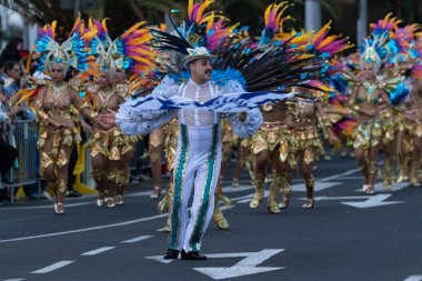 SANTA CRUZ DE TENERIFE, SPAIN - FEBRUARY 21, 2023: Coso parade - along the Avenida de Anaga, official end of Carnival. Again march carnival groups, floats, decorated cars and the Carnival Queens.