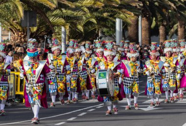 SANTA CRUZ DE TENERIFE, SPAIN - FEBRUARY 21, 2023: Coso parade - along the Avenida de Anaga, official end of Carnival. Again march carnival groups, floats, decorated cars and the Carnival Queens.